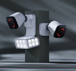 Dual Vivint outdoor floodlight cameras with motion-activated lighting, designed for smart home security and enhanced nighttime surveillance in wireless alarm systems.