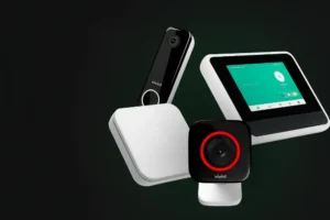 Smart home security setup featuring a touchscreen control panel, wireless doorbell camera, indoor security camera, and smart thermostat—ideal for integrated alarm systems and home automation.