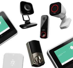 Assortment of Vivint smart security devices including indoor and outdoor cameras, video doorbell, touchscreen control panels, smart thermostat, and keyless smart lock for a comprehensive home alarm system.
